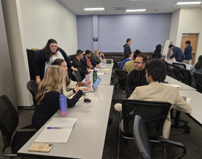 Adults in a classroom setting learning something