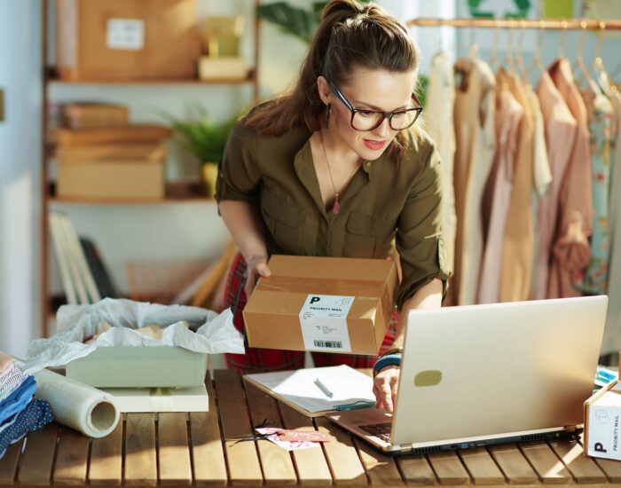 Small business owner working on a laptop in the office